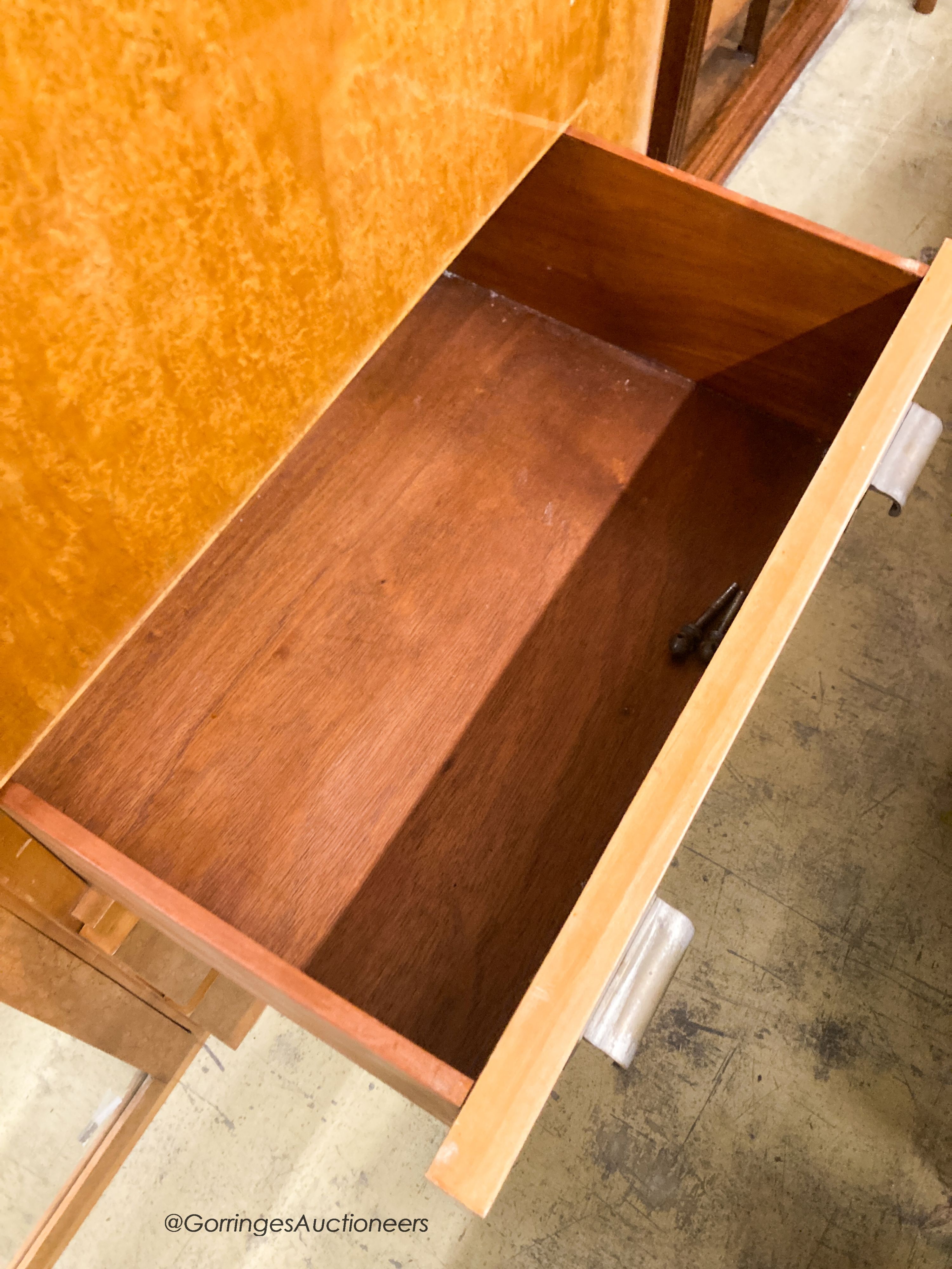 A French Art Deco birds eye maple and mahogany compactum wardrobe, W.174cm D.51cm H.181cm